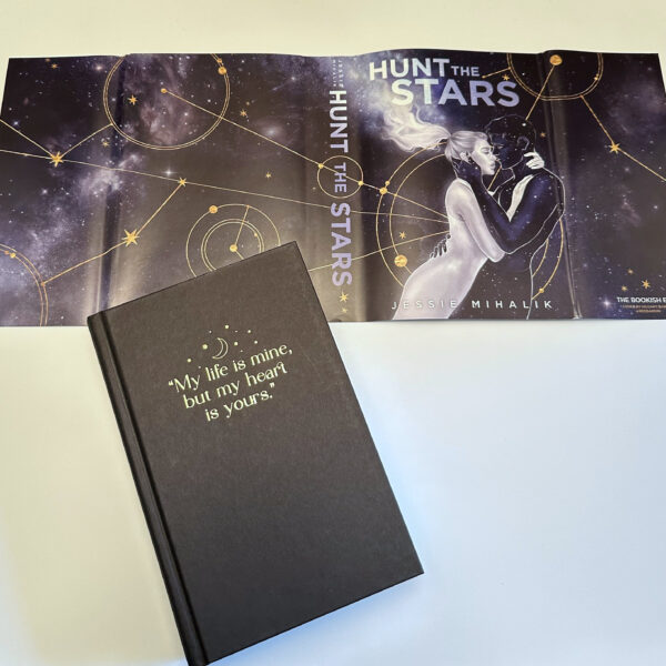 The Bookish Box special edition with a quote on the front and the custom cover artwork on the dust jacket behind.
